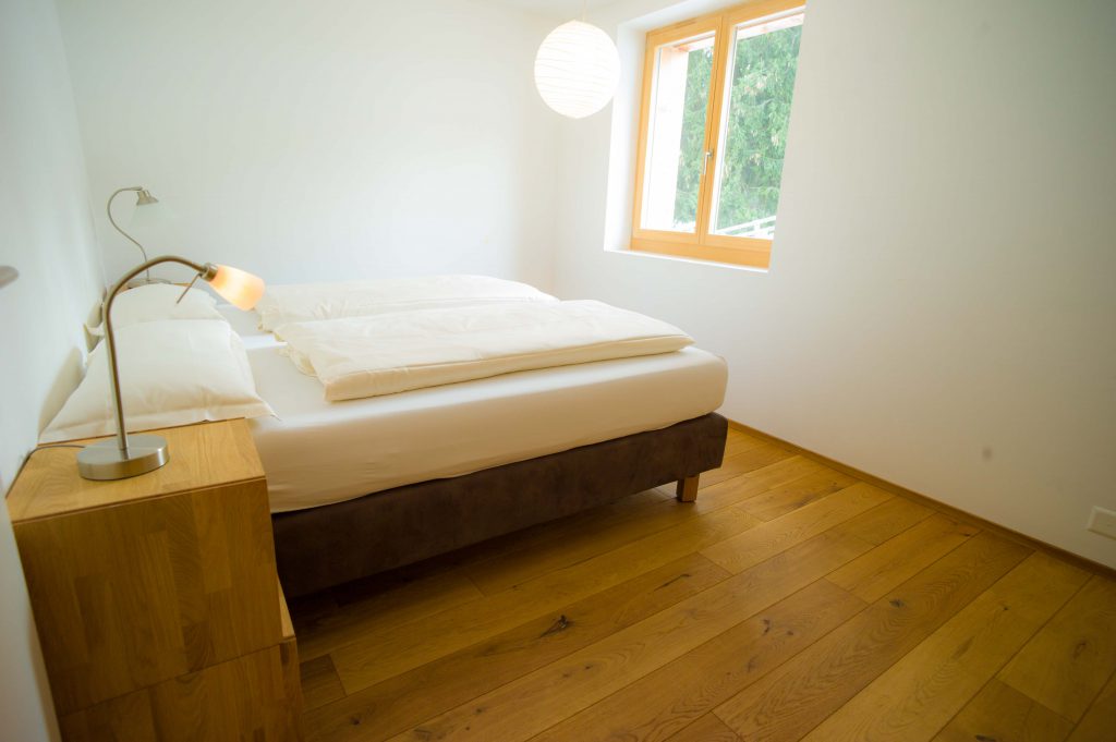 3rd double bedrooms with 2 orthopedic Boxspring beds, window with view west side. Naturally heated wood floor in all rooms.
